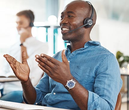Call center, customer service with a business man working in an office and consulting on a headset. 